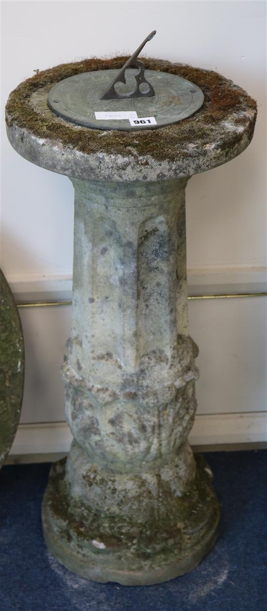 A composition stone pedestal sun dial and a mill stone W.32cm and W.59cm